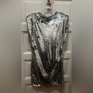 Looking for the perfect party dress? H&M Shimmering Silver Sequin mini dress.
